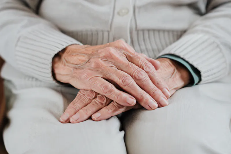 Caregiver assisting an older patient
