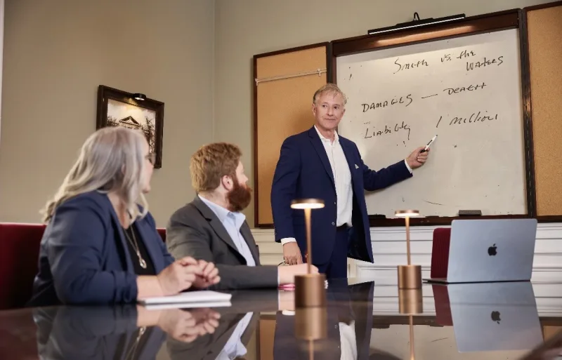 The Large and Associates team reviewing a case